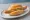 Wiener Würstchen: an illustration of pork, beef and mustard on kaiser roll.