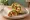Wrap Wegetariański: an illustration of lettuce, tomato, cucumber, pepper and more on tortilla.
