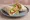 Wrap z Kurczakiem: an illustration of chicken, lettuce and tomato on tortilla.