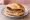 Würzburger Bratwurst: an illustration of mustard on kaiser roll.