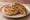 Xiàn Bǐng (馅饼): an illustration of pork, scallion, ginger, maggi seasoning sauce and more.