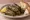 Yaprak Sarma: an illustration of lamb, rice, onion, olive oil and more on bread.