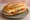 Yumurtalı Sandviç: an illustration of egg, butter, tomato and cucumber on bread.