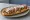 Zapiekanka Gyros: an illustration of pork, chicken, mushroom, cheese and more.