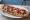 Zapiekanka Studencka: an illustration of mushroom, cheese, onion and ketchup.
