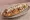 Zapiekanka z Kebabem: an illustration of pork, chicken, mushroom, cheese and more.