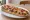 Zapiekanka z Szynką: an illustration of ham, mushroom, cheese, onion and more.